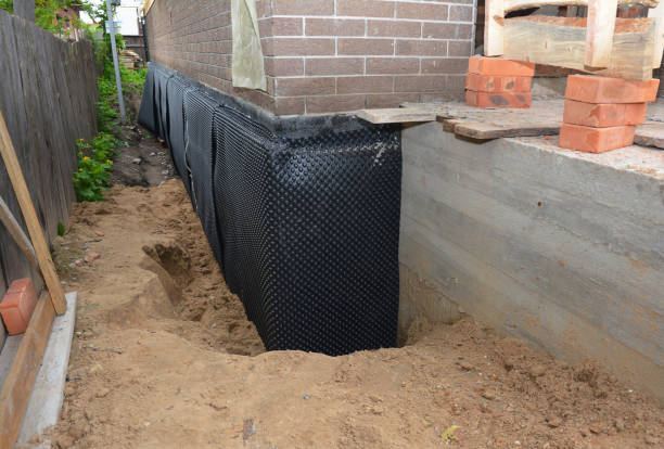 SJ Waterproofing Pros technician performing targeted Emergency Waterproofing assessment in Lawrenceville, IL